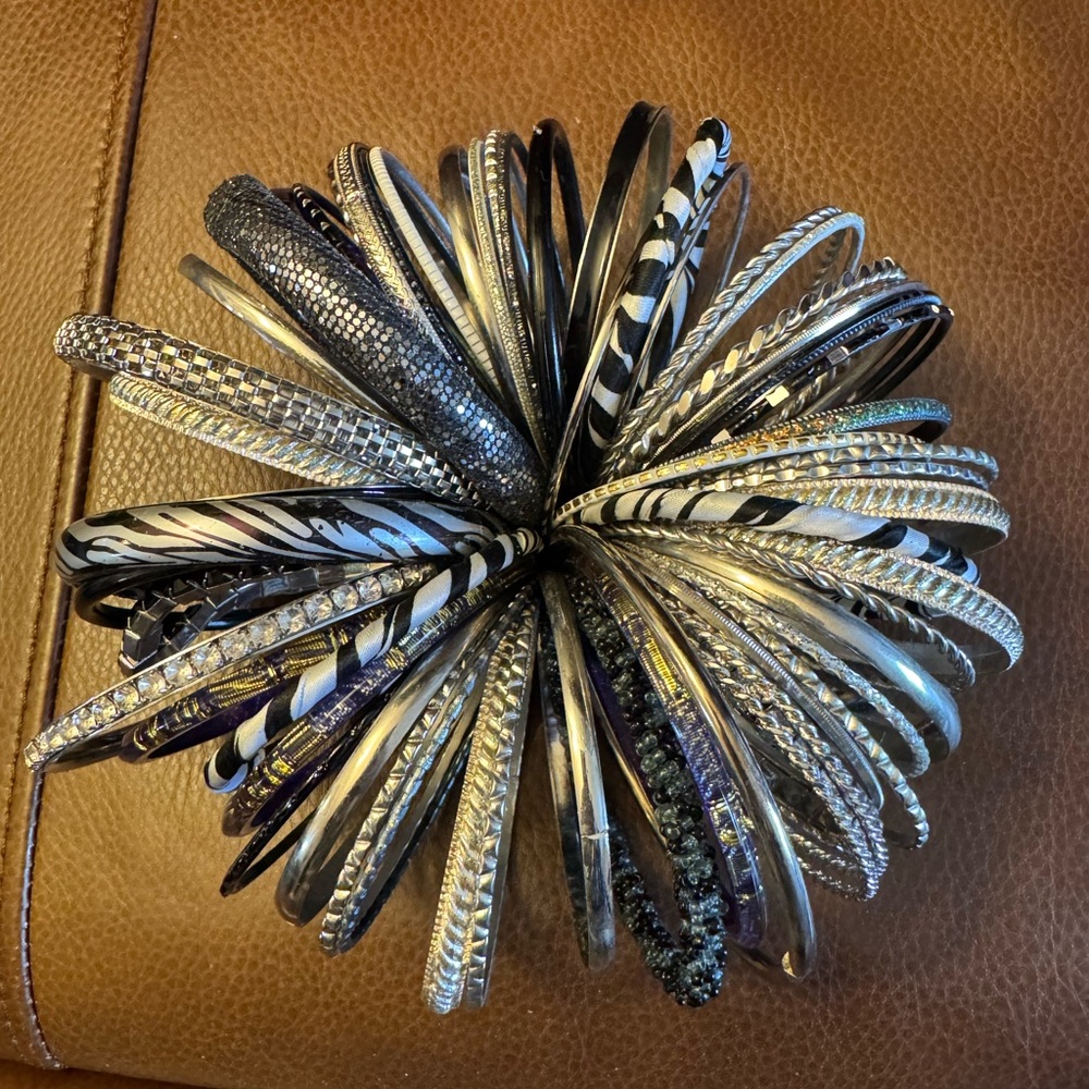 Lot of 60 various silver tone, fabric, black and rhinestone bangle bracelets